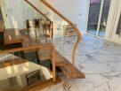 Steel staircase with timber treads and glass balustrades