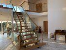 Steel staircase with timber treads and glass balustrades