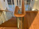 Steel staircase with timber treads and glass balustrades